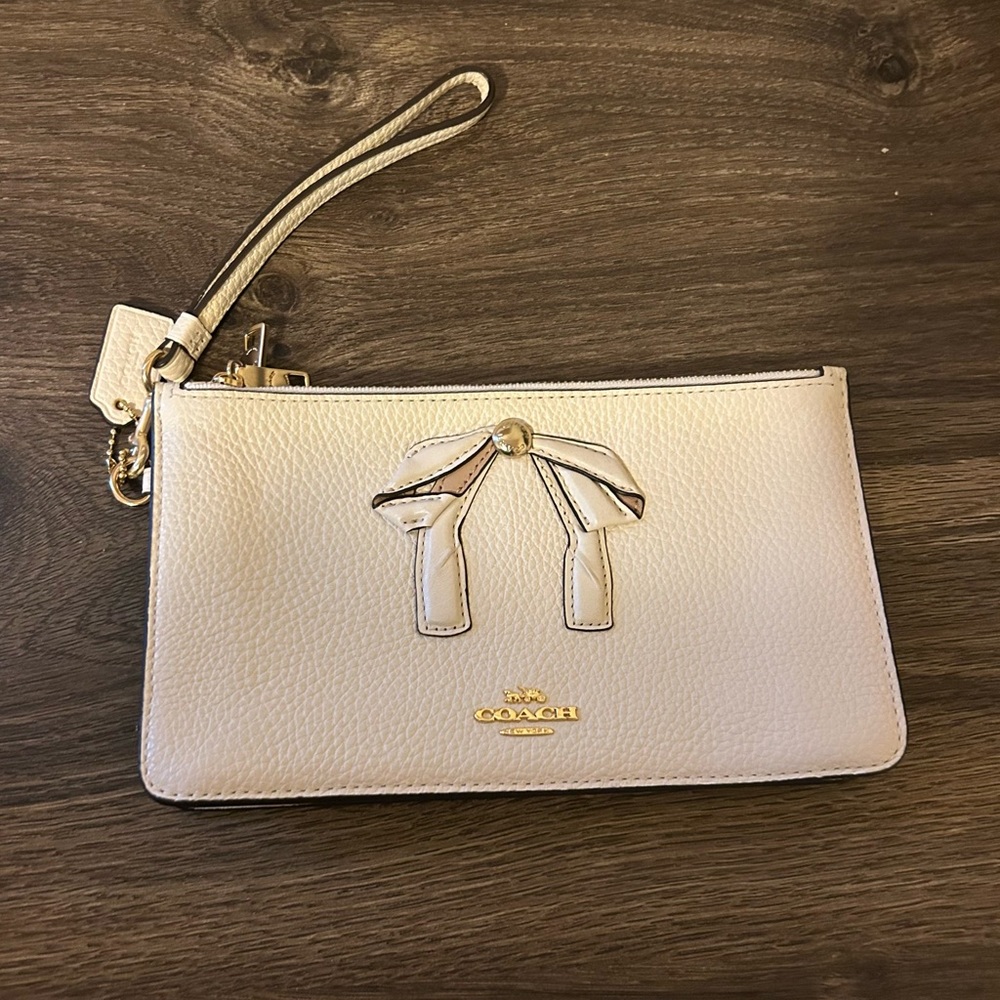 Coach Off White Triple Entry Leather Wristlet with a Bow Detail